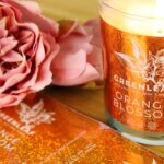 Lovely shiny orange blossom sticker on product